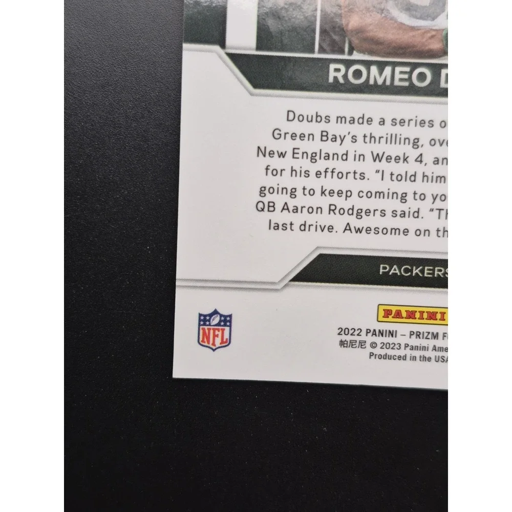 2022‎ Panini Prizm Romeo Doubs #E-14 Emergent Blue Ice Prizm /99 (RC) Packers